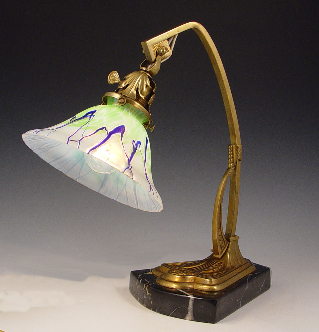 Appraisal: ART DECO LOETZ ART GLASS LAMP Adjustable angle brass lamp