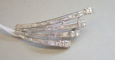 Appraisal: A diamond brooch designed as a spray set with four