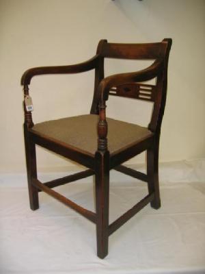 Appraisal: A GEORGE III MAHOGANY ELBOW CHAIR of Sheraton type with