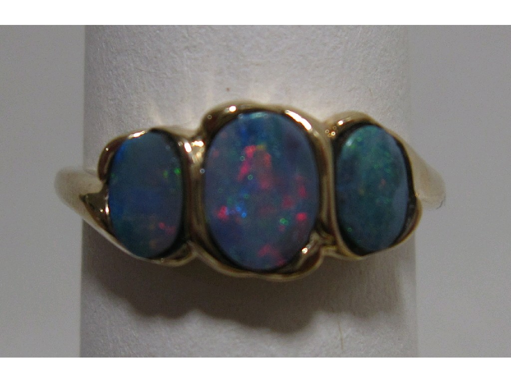 Appraisal: Nine carat gold black opal triplet three stone ring