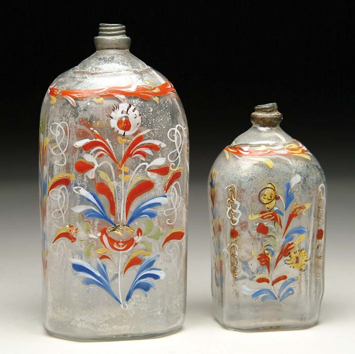 Appraisal: TWO STIEGEL-TYPE BOTTLES Two clear blown half-post bottles with polychrome