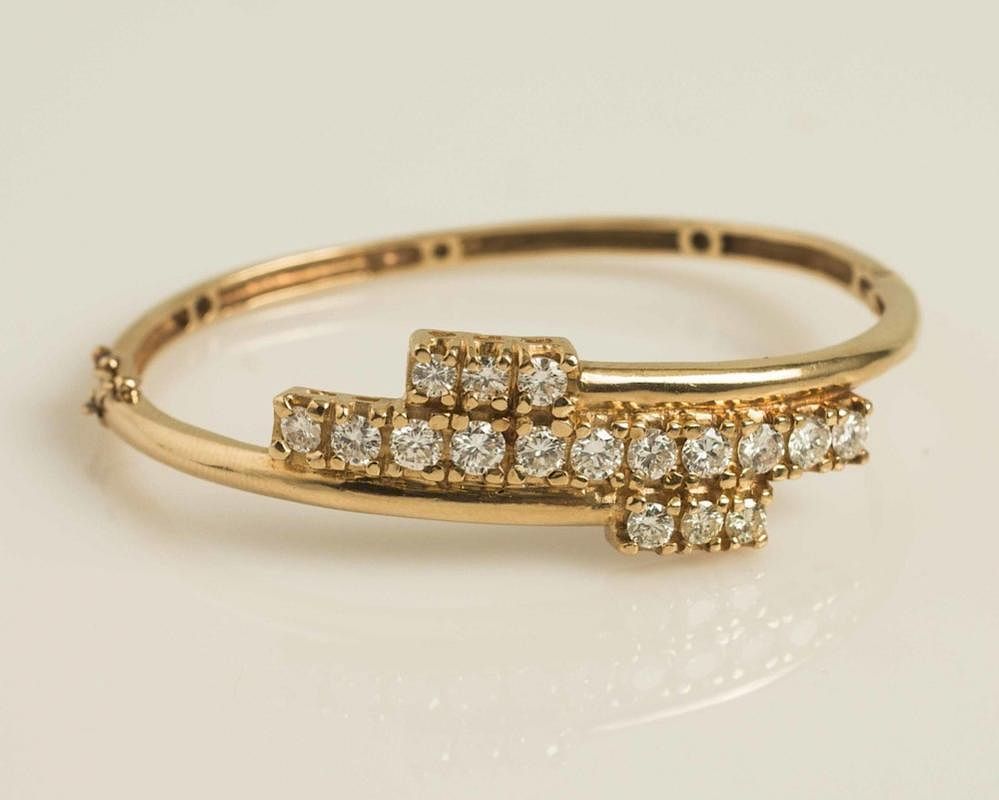 Appraisal: Diamond k Gold Bracelet A k gold hinged bracelet accented