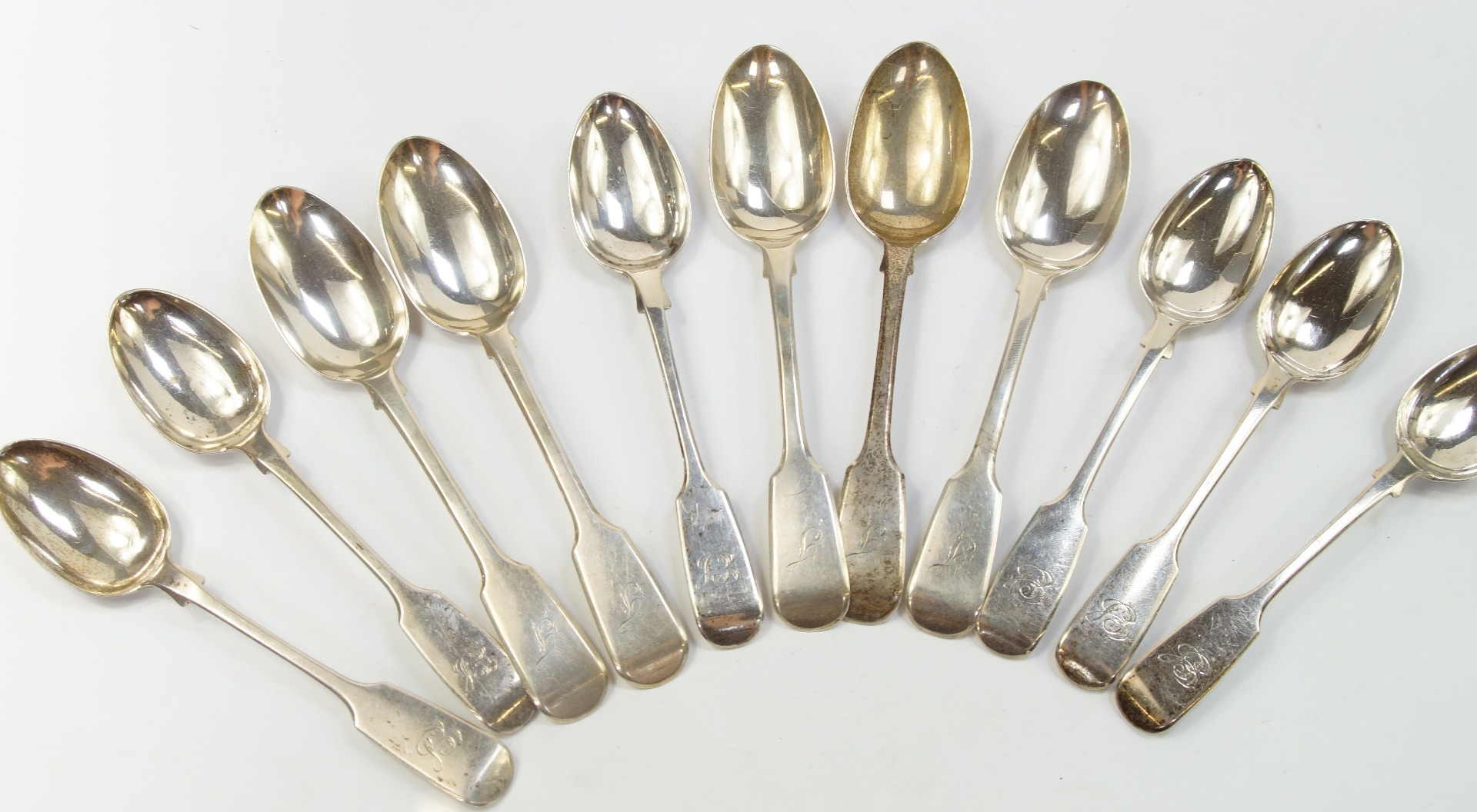 Appraisal: A set of nine Victorian silver teaspoons decorated in the