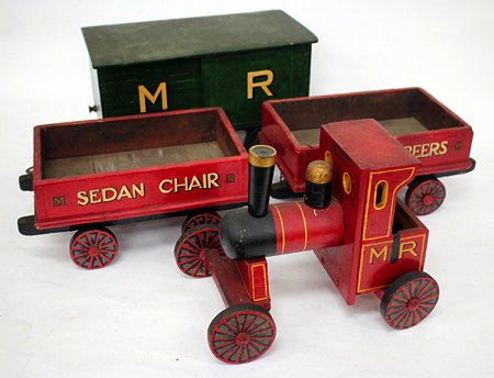 Appraisal: A RED AND GREEN PAINTED WOODEN TOY TRAIN with locomotive