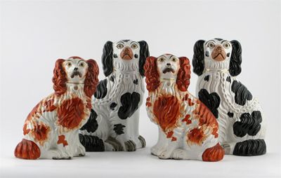 Appraisal: Two pairs of Staffordshire spaniels one pair painted with iron