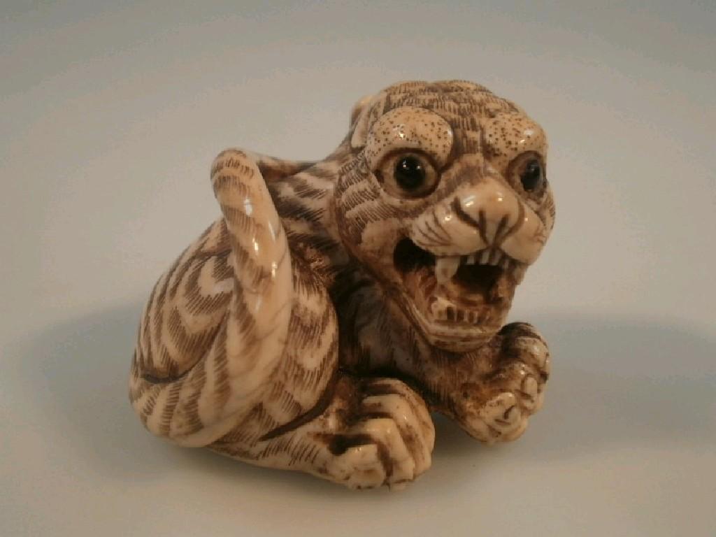 Appraisal: An oriental carved ivory netsuke in the form of a