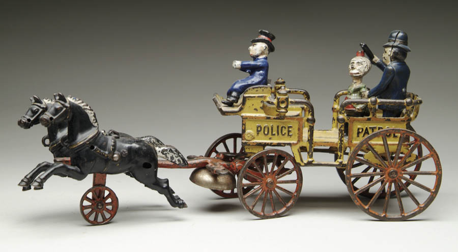 Appraisal: KENTON HAPPY HOOLIGAN POLICE PATROL Comical cast iron toy As