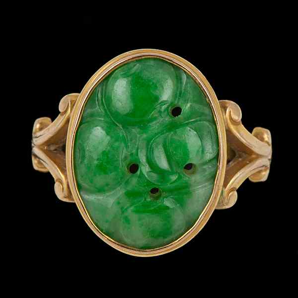 Appraisal: k Carved Jadeite Ring k yellow gold ring containing a