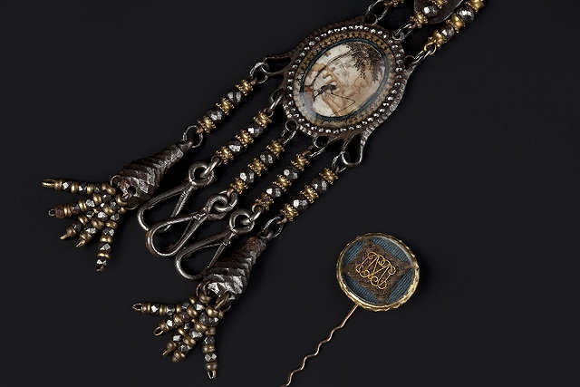 Appraisal: A MEMORIAL STICK PIN AND A CHATELAINE the stick pin