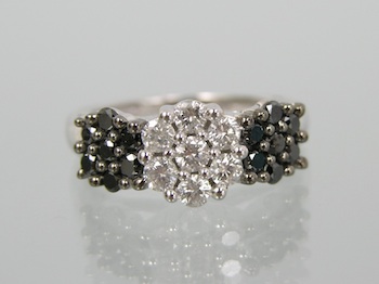 Appraisal: A Black and White Diamonds Ring k white gold ring