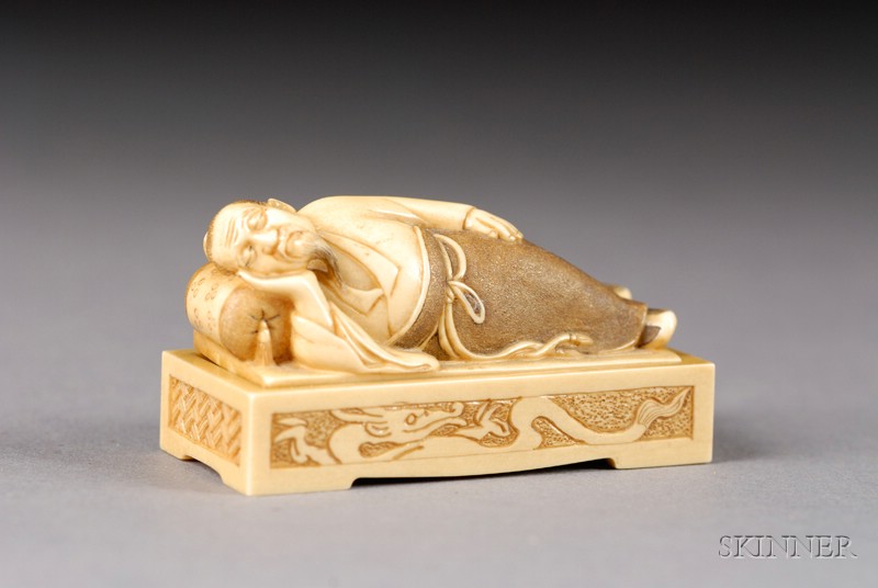 Appraisal: Ivory Netsuke late th century two-part scene of a man