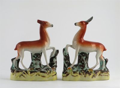 Appraisal: A pair of Staffordshire models of a stag and a