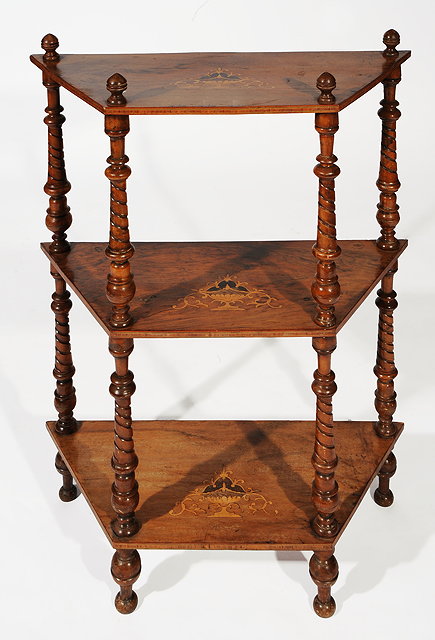 Appraisal: A VICTORIAN WALNUT WHATNOT with three shelves each inlaid with