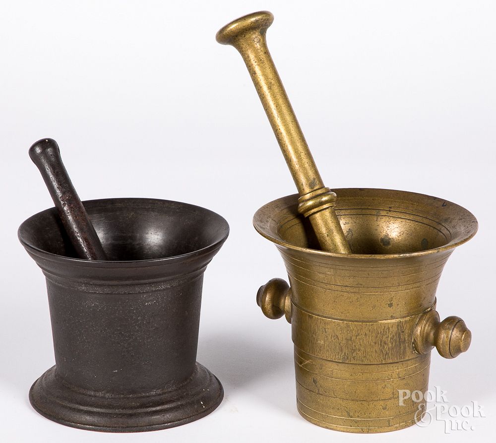 Appraisal: Two antique brass and iron mortar and pestles Two antique