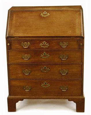 Appraisal: A George III mahogany bureau the hinged fall revealing pigeon