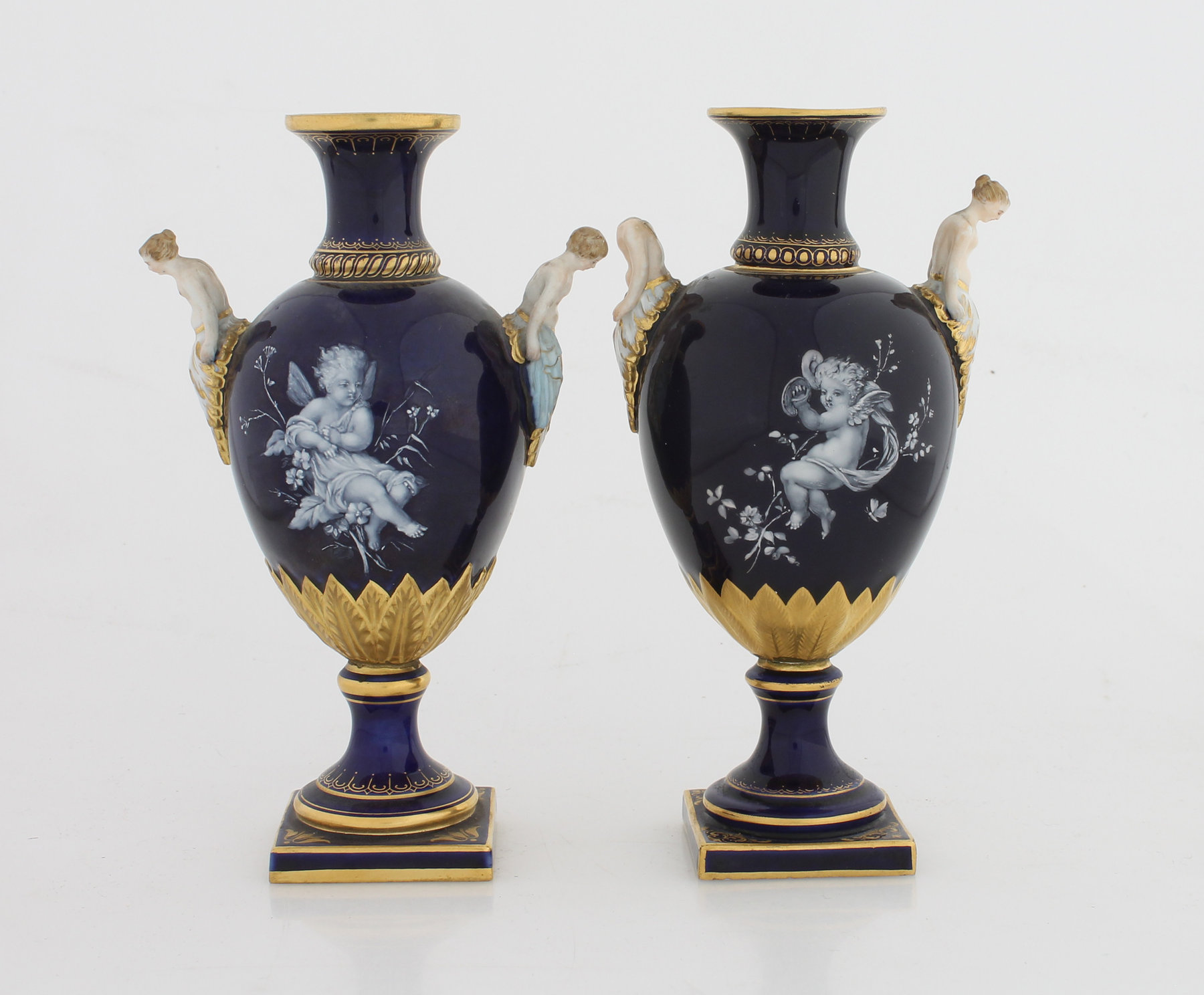 Appraisal: A near pair of Meissen urns circa each with narrow