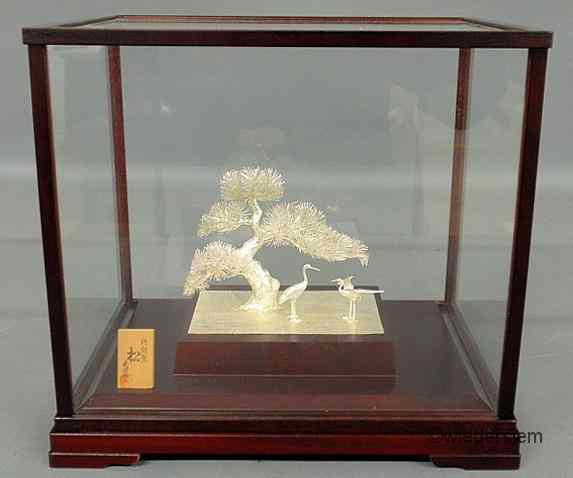 Appraisal: Glass cased Chinese silver figural group with a bonsai tree