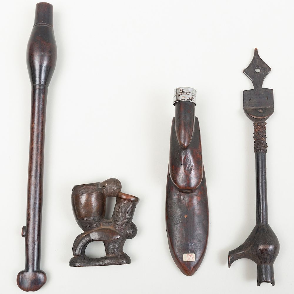 Appraisal: Three African Wooden Pipes Together with a Pottery Pipe one