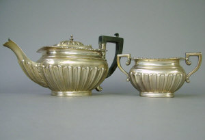 Appraisal: An Edwardian silver bachelors tea pot with matching sugar by