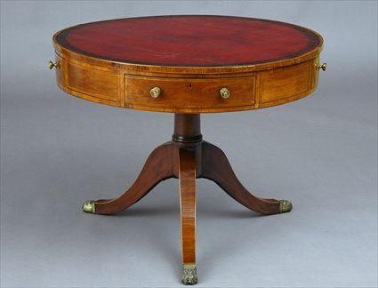 Appraisal: REGENCY MAHOGANY AND ROSEWOOD-VENEERED DRUM TABLE The circular cross-banded leather-paneled