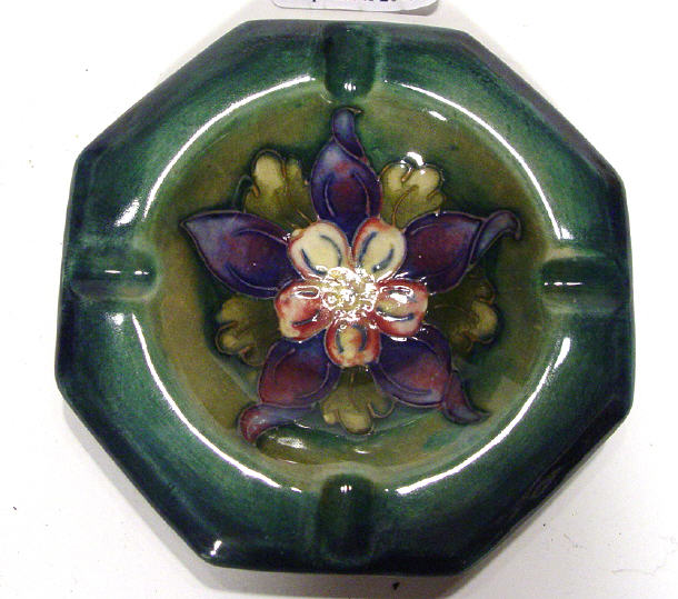 Appraisal: Moorcroft triangular ashtray hand painted and tubelined with hibiscus pattern