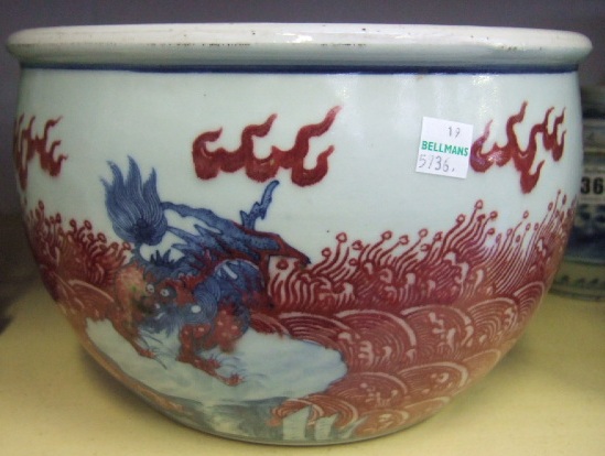 Appraisal: An underglaze blue and iron-red jardiniere late th century decorated