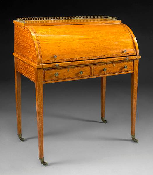 Appraisal: A George III style kingwood crossbanded satinwood cylinder desk stamped