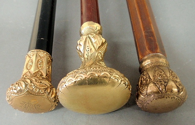 Appraisal: - Three Victorian walking sticks with gold-filled handles one monogrammed