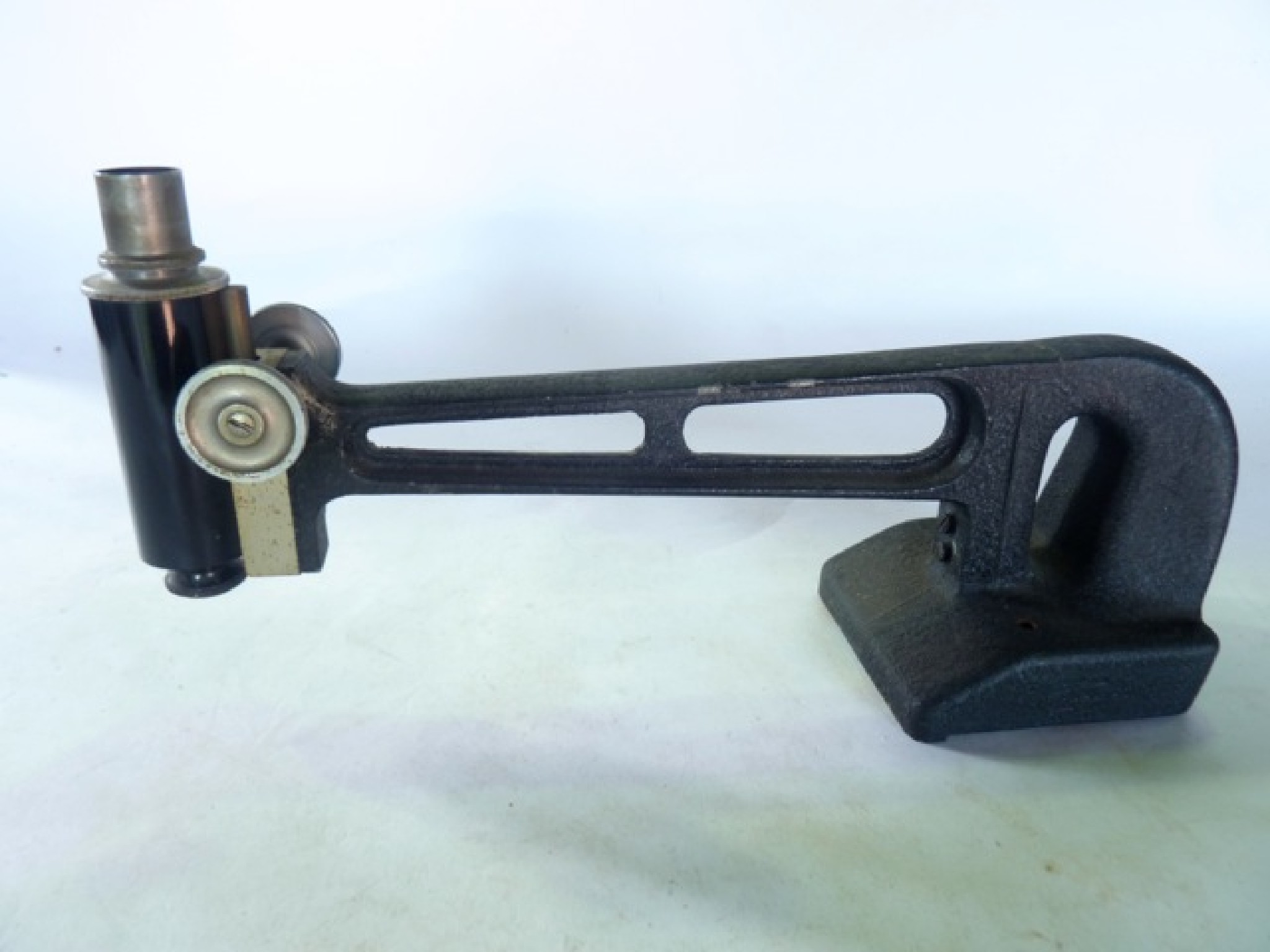 Appraisal: An unusual microscope bracket the iron arm accommodating an adjustable