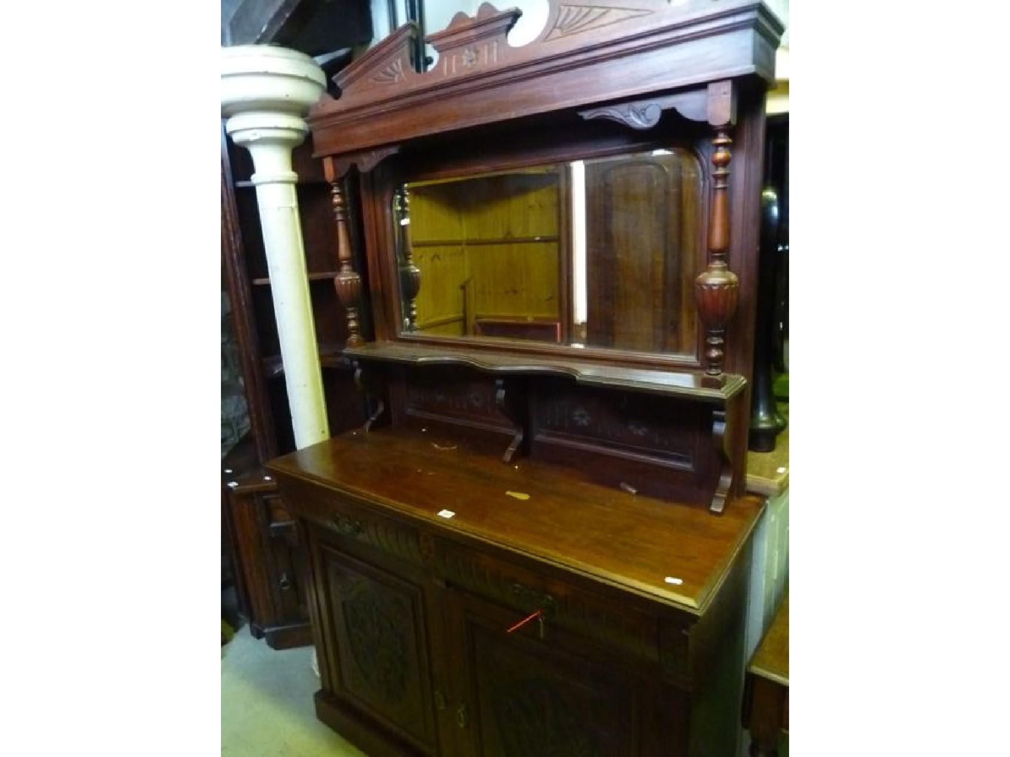 Appraisal: An Edwardian American walnut cottage sideboard the lower section enclosed