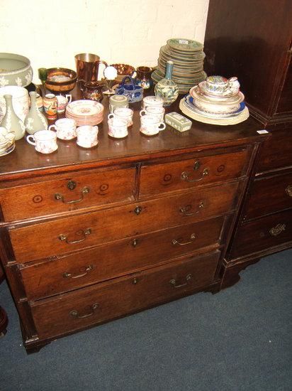 Appraisal: An antique oak chest of two short and three long