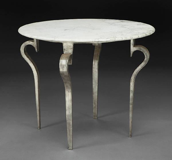 Appraisal: An Art Deco style silvered metal and marble center table