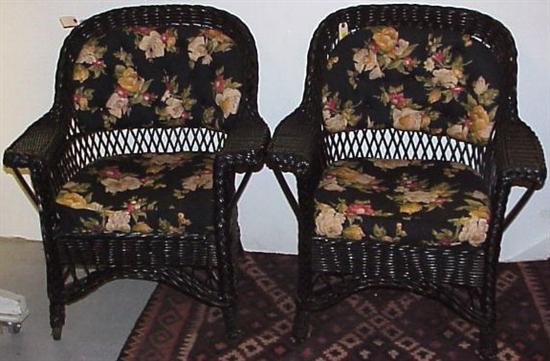 Appraisal: Wicker two armchairs early th C painted black custom cushions