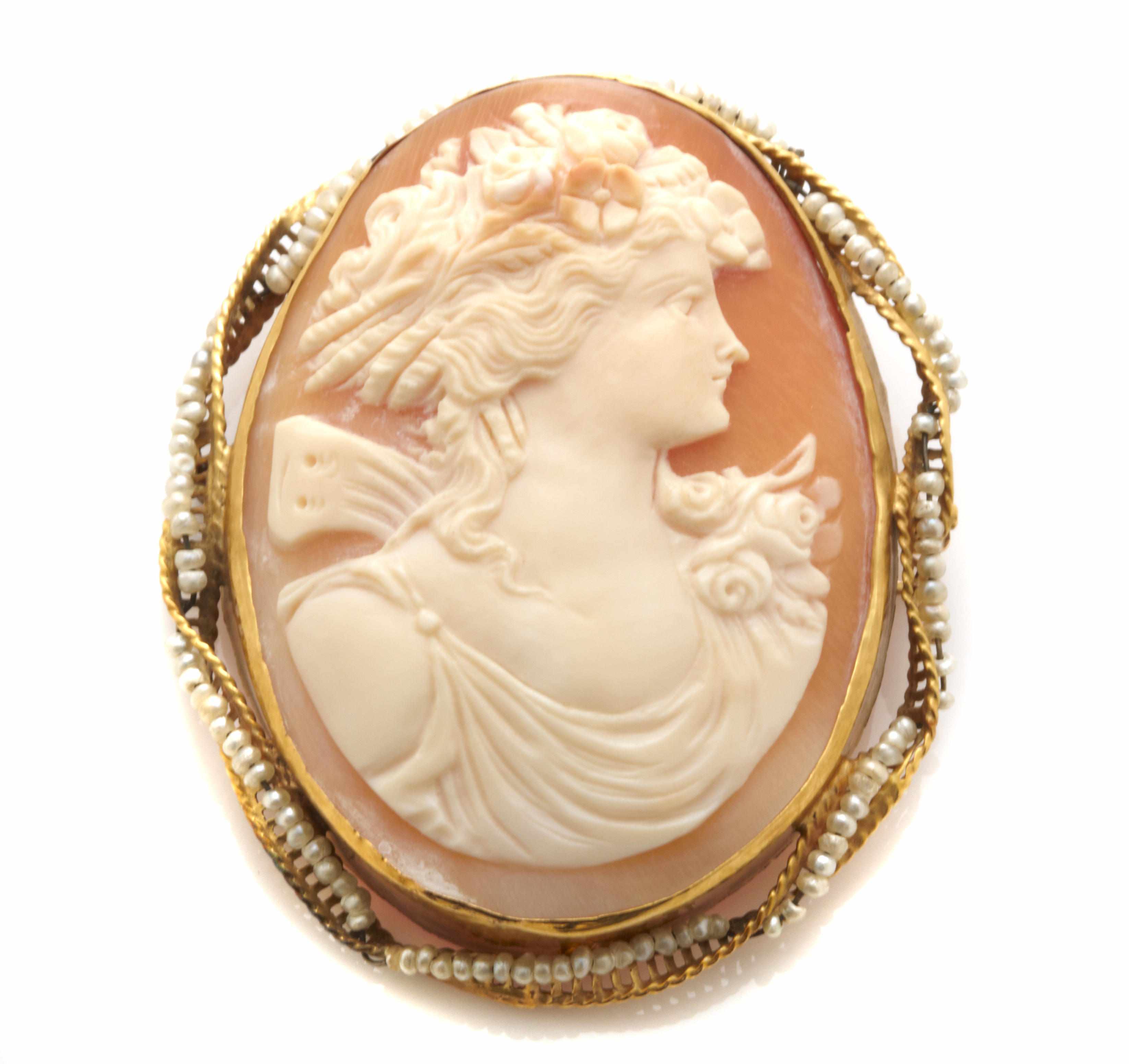 Appraisal: A seed pearl and gold cameo brooch dimensions x in