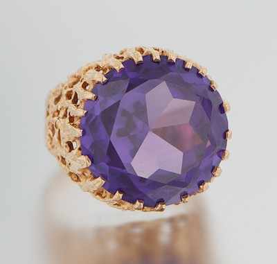 Appraisal: A Large Synthetic Color Change Sapphire and Gold Ring Signed