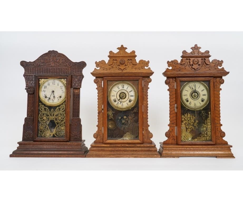 Appraisal: Three oak gingerbread clocks by Gilbert and two by Seth