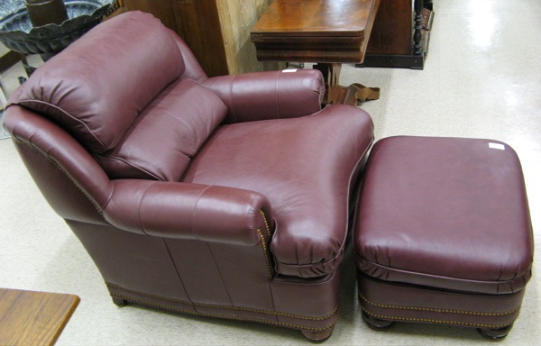 Appraisal: BURGUNDY LEATHER AUSTIN CHAIR AND OTTOMAN Hancock Moore Hickory N