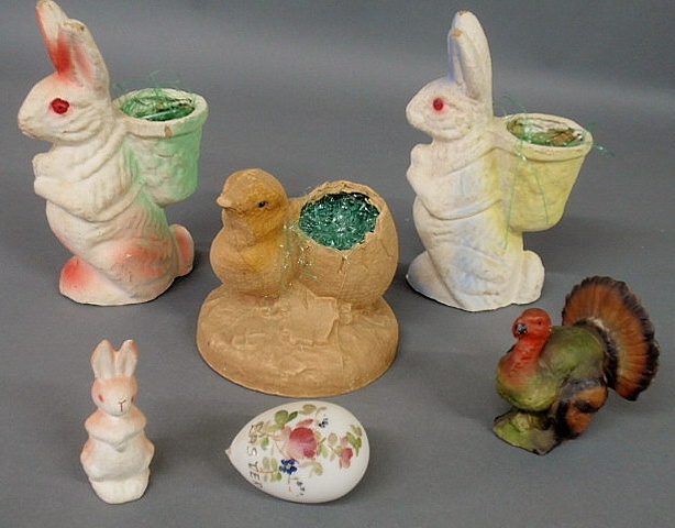 Appraisal: Two papier-m ch Easter rabbits with baskets h each a