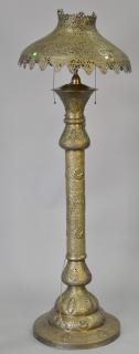 Appraisal: Egyptian brass floor lamp with embossed figures animals and sphynx