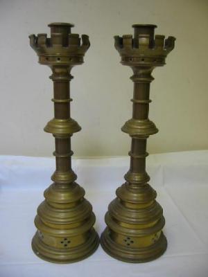 Appraisal: A PAIR OF CHURCH BRASS CANDLESTICKS the circular pierced and