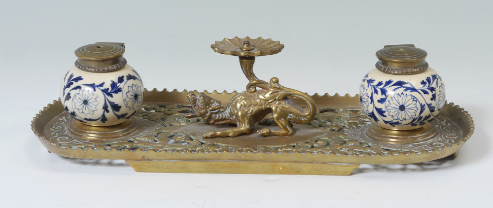 Appraisal: ENGLISH BRASS AND CERAMIC FIGURAL DESK SET English registry marks