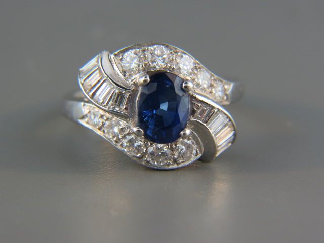 Appraisal: Sapphire Diamond Ring rich blue oval gem weighing carat with