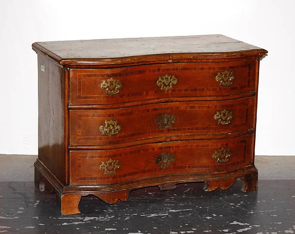 Appraisal: A Continental Baroque crossbanded oak and mahogany chest of drawers