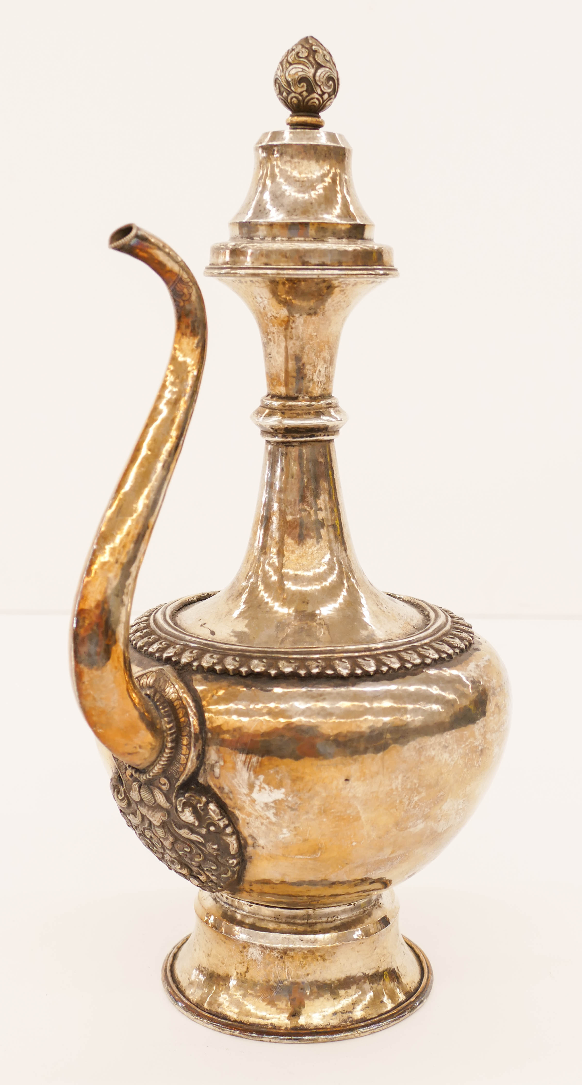 Appraisal: Tibetan Decorated Silver Ewer ''x '' A hand hammered silver