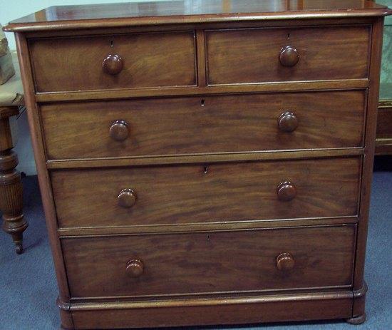 Appraisal: A mid Victorian mahogany chest fitted three long and two