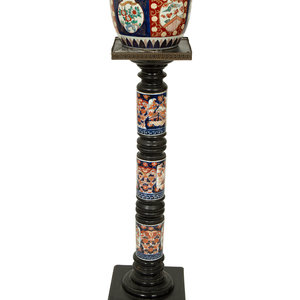 Appraisal: An Imari Porcelain Jardiniere on an Ebonized Pedestal with Imari