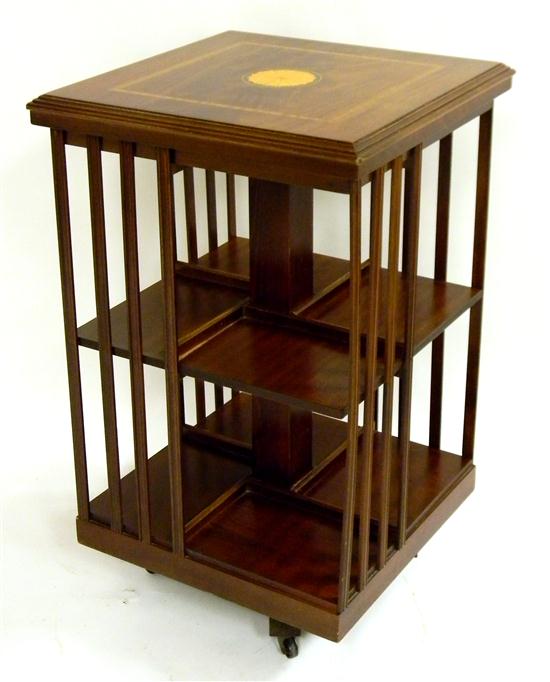 Appraisal: Revolving book stand mahogany and mahogany veneer with band inlay