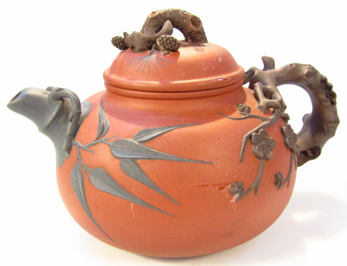 Appraisal: An thC style Chinese redware pottery teapot the compressed domed