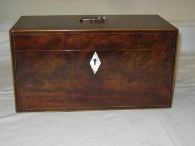 Appraisal: A GEORGE III MAHOGANY TEA CADDY of oblong form crossbanded