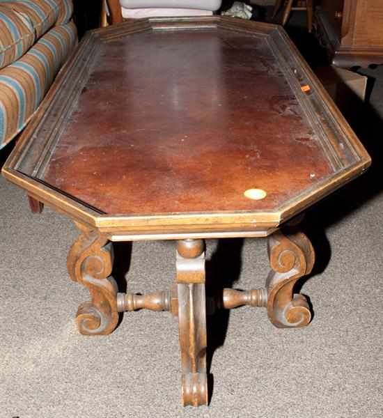 Appraisal: Classical style carved walnut coffee table with inset tooled leather